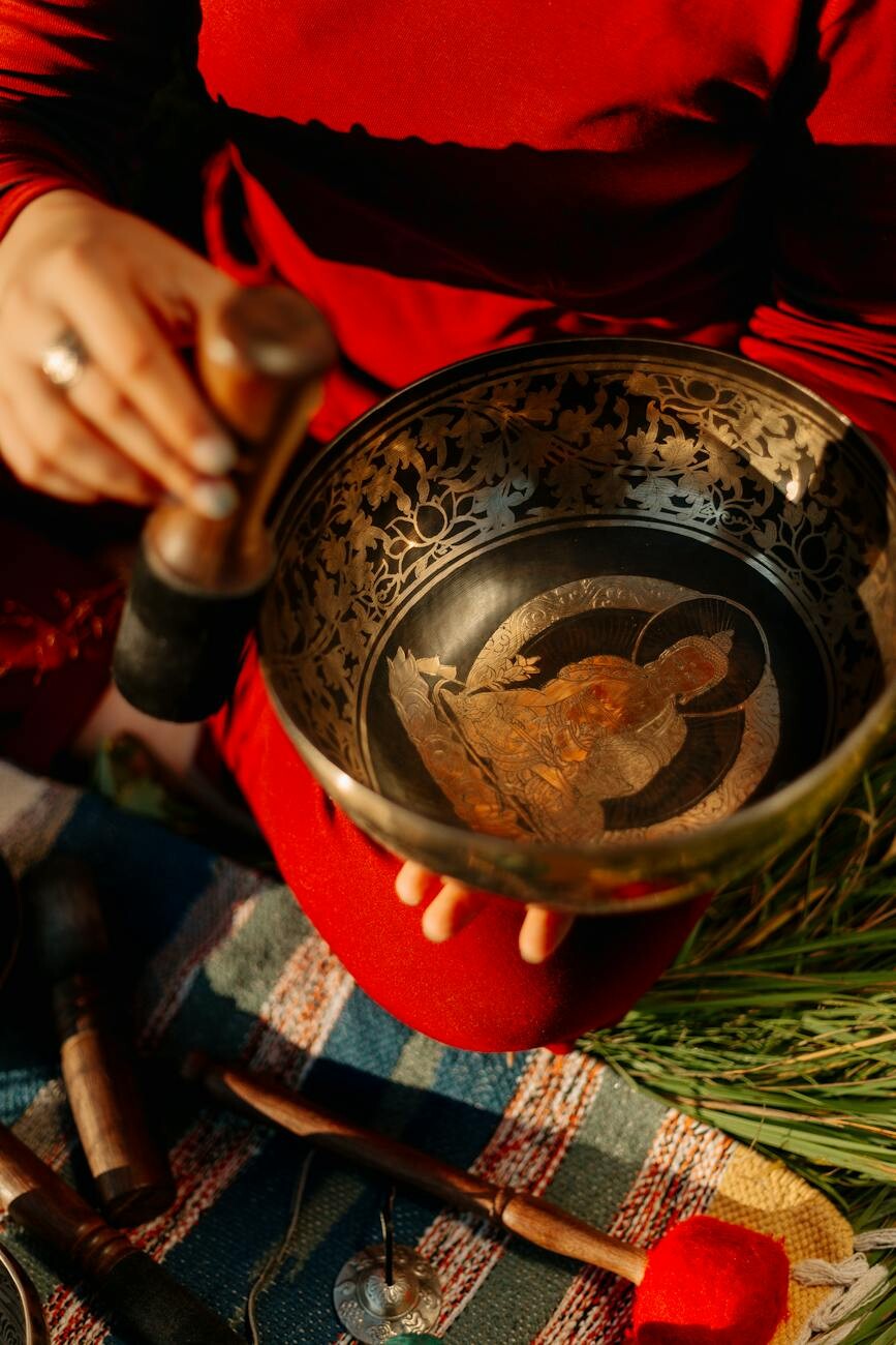 person holding stainless steel bowl with food